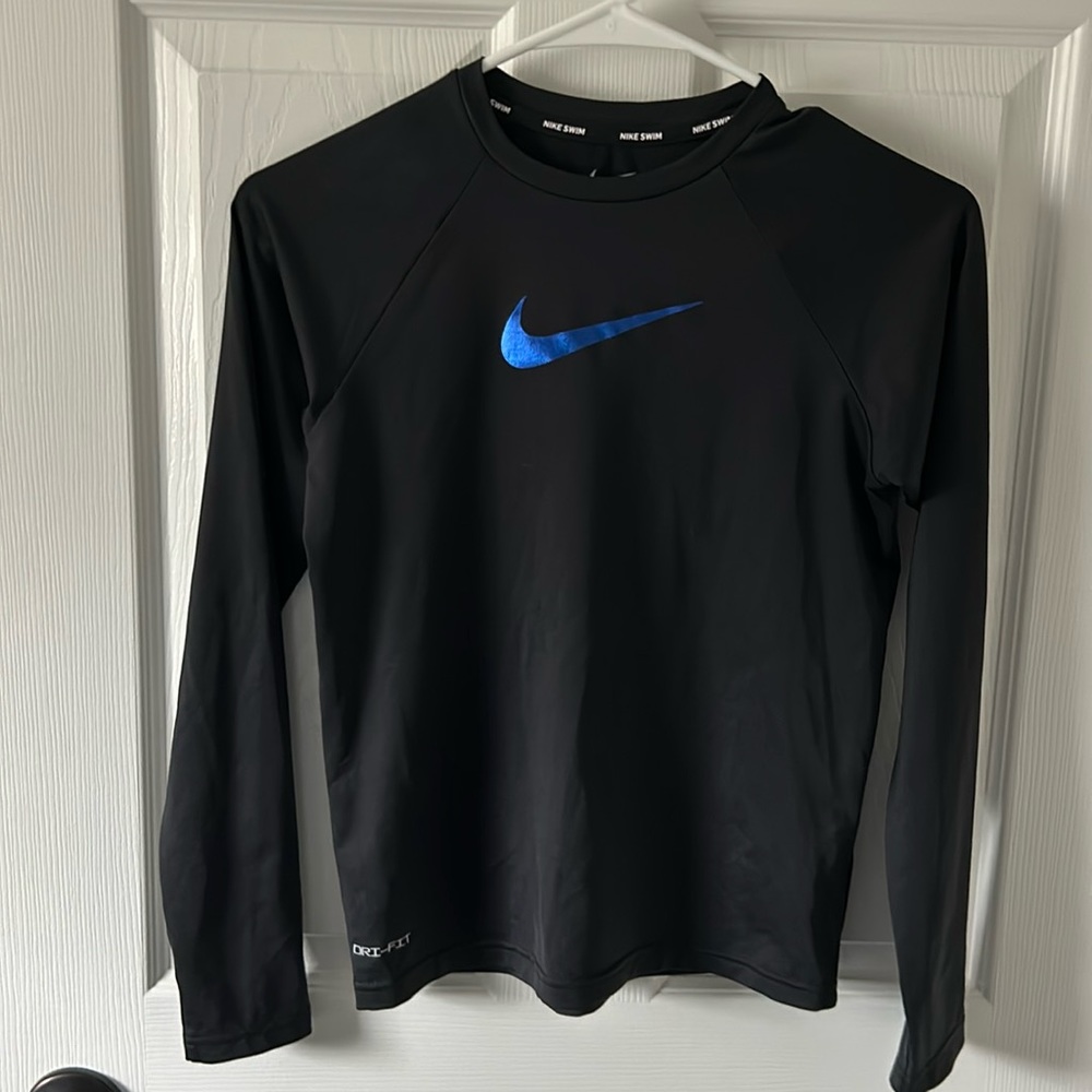 Nike dri fit swim shirt. Size large (kids). Black with blue swoosh. Excellent!